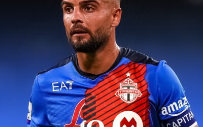 Insigne davanti ad una miniera d’oro